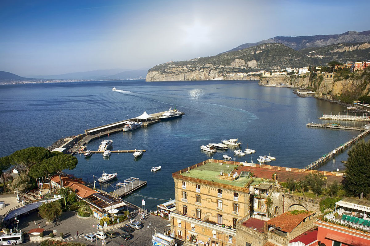 <b>Grand Hotel Royal, Sorrento</b> - Featuring a private beach on site, the Grand Hotel Royal is an elegant estate overlooking the Gulf of Naples from its perch on a cliff. Wander through the palm-filled gardens and smell the citrus trees at sunset before retreating to your suite which features contemporary-classic furnishings.