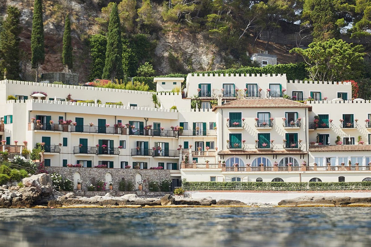 <b>Belmond Villa Sant’Andrea, Taormina</b> - Bright and airy, this 1830s hotel on Mazzaro Bay features cabanas lining their private beach and a pool overlooking the ocean. It is easy refinement meets glossy beach chic with a hint of Old-World glamor.