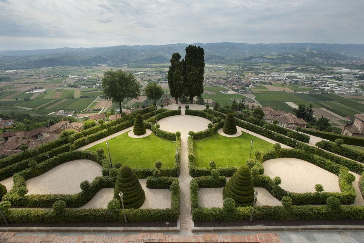 <b>Relais & Chateaux Castello di Guarene</b> - Set on a hill overlooking the lush landscape, this 18th century palace is striking in appearance. With a stately garden and an underground cave pool to enjoy, guests feel the grandeur and splendor of Old-World luxury.