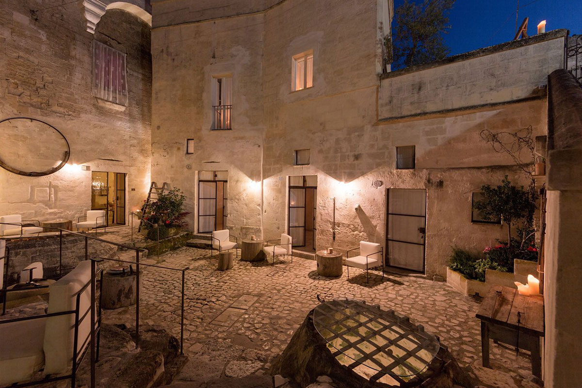 <b>Corte San Pietro, Matera</b> - Cave dwellings, tufa stone courtyards and herb gardens are all things you’ll find when arriving at the Corte San Pietro. Quite like a dream, you will sleep in a plush cave room with a design worthy of an architectural magazine.