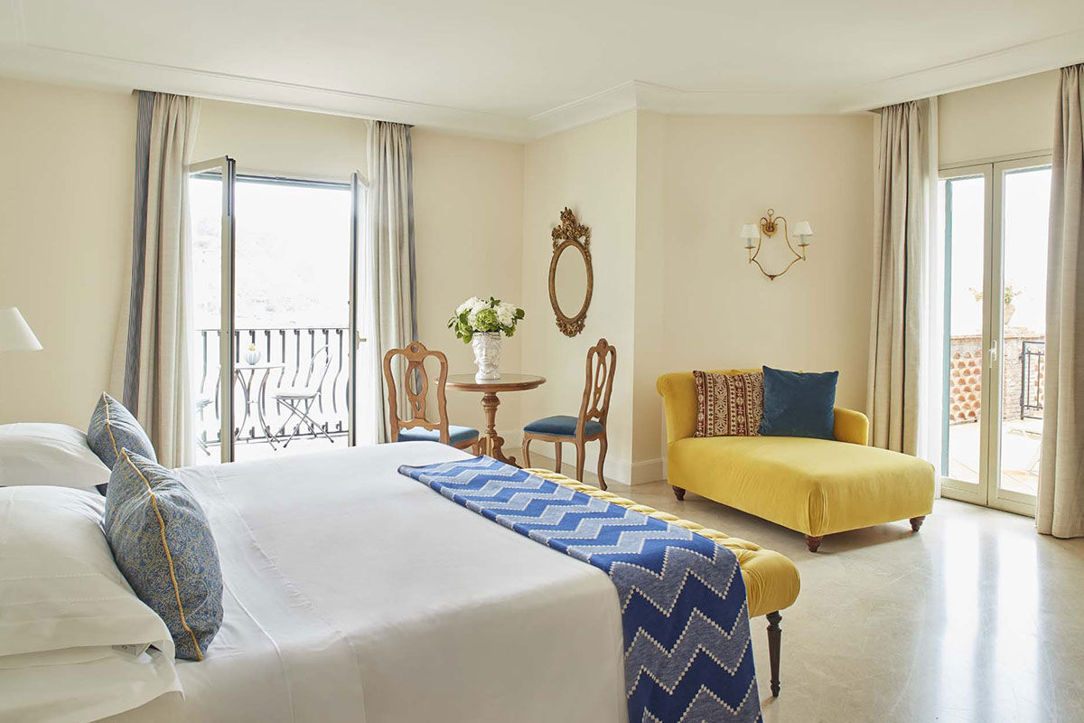 <b>Belmond Villa Sant’Andrea, Taormina</b> - Bright and airy, this 1830s hotel on Mazzaro Bay features cabanas lining their private beach and a pool overlooking the ocean. It is easy refinement meets glossy beach chic with a hint of Old-World glamor.