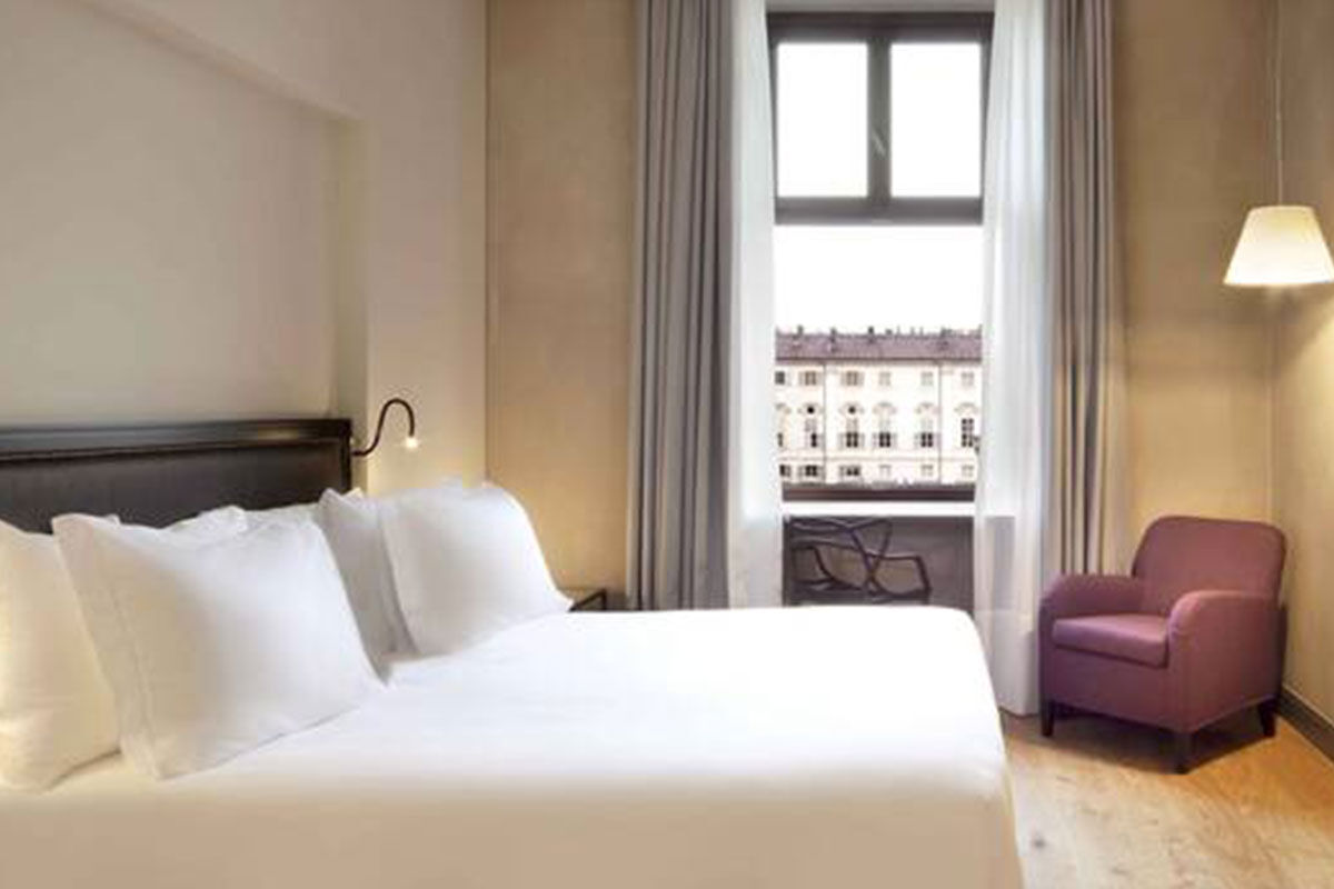 <b>NH Collection Piazza Carlina</b> - Sleek and modern rooms join to make up this upscale hotel that is housed in a 17th century building. Guests enjoy city views on either of two rooftop terraces and savor the Italian cuisine in the airy and monochromatic restaurant.