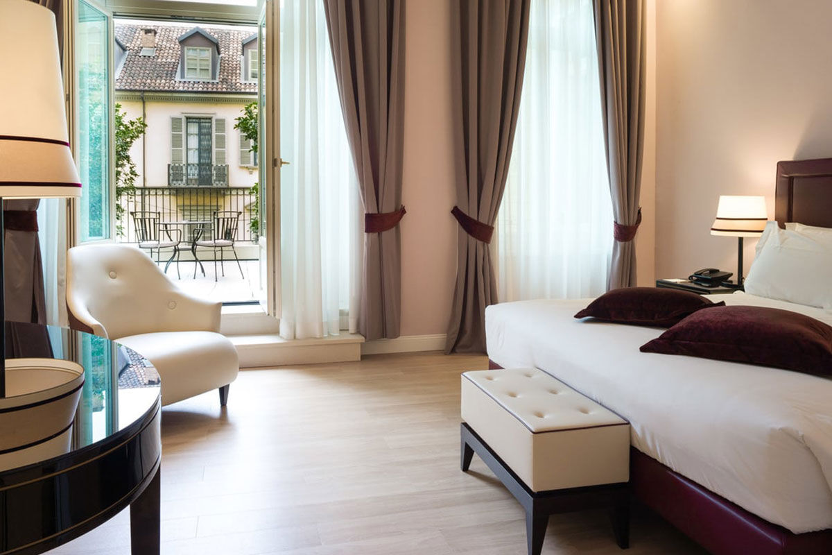 <b>Turin Palace Hotel</b> - Only a 3-minute walk to the train station, The Turin Palace hotel is a convenient and stylish choice for the cosmopolitan traveler. It offers panoramic city views from its rooftop terrace, as well as refined rooms with chic décor.