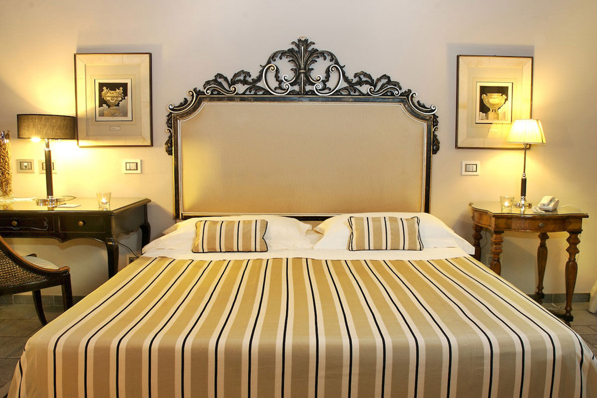<b>Villa Carlotta, Taormina</b> - An independent boutique hotel on the banks of the Ionian Sea, Villa Carlotta is housed within an 1860 aristocratic villa with views of Mt. Etna. The local Sicilian cuisine served on the refined rooftop terrace makes this retreat absolutely idyllic.