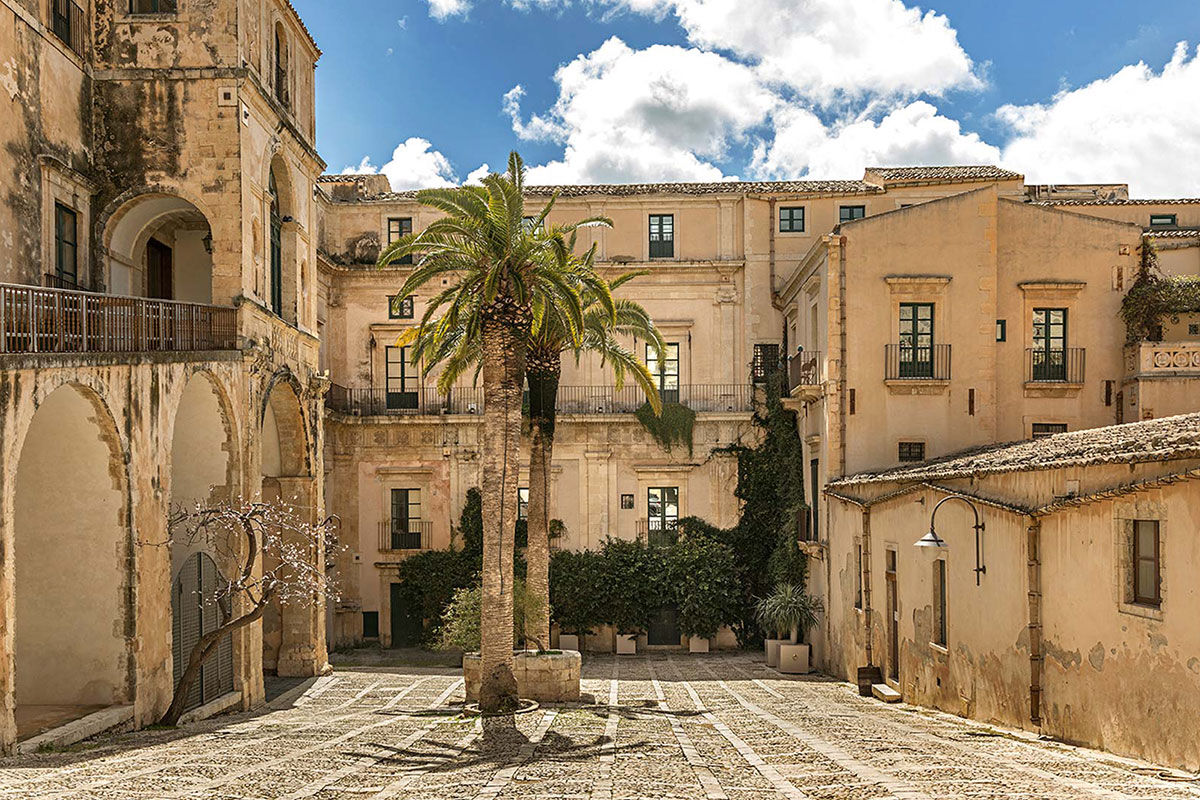 <b>Seven Rooms Villadorata, Noto</b> - Having once been home to a prince, there’s a stately air to Seven Rooms Villadorata with its floor to ceiling windows, gilded tiles and frescoed ceilings. The cocktail bar is swanky, the restaurant has vaulted ceilings and fine fabrics are used throughout the property for an especially luxurious palette.