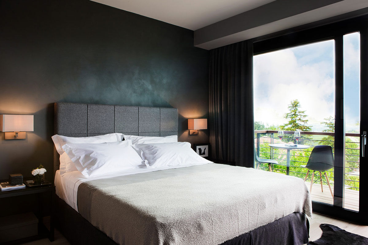 <b>Arborina Relais</b> - Surrounded by Barolo hill vineyards and sitting atop lush grounds, the Arborina Relais is a modern boutique hotel that offers luxury and style. The architectural lines, large windows and natural materials make it an experience hand in hand with nature.