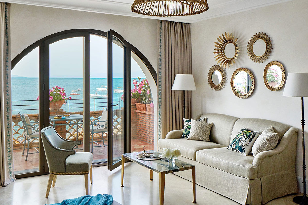 <b>Belmond Villa Sant’Andrea, Taormina</b> - Bright and airy, this 1830s hotel on Mazzaro Bay features cabanas lining their private beach and a pool overlooking the ocean. It is easy refinement meets glossy beach chic with a hint of Old-World glamor.