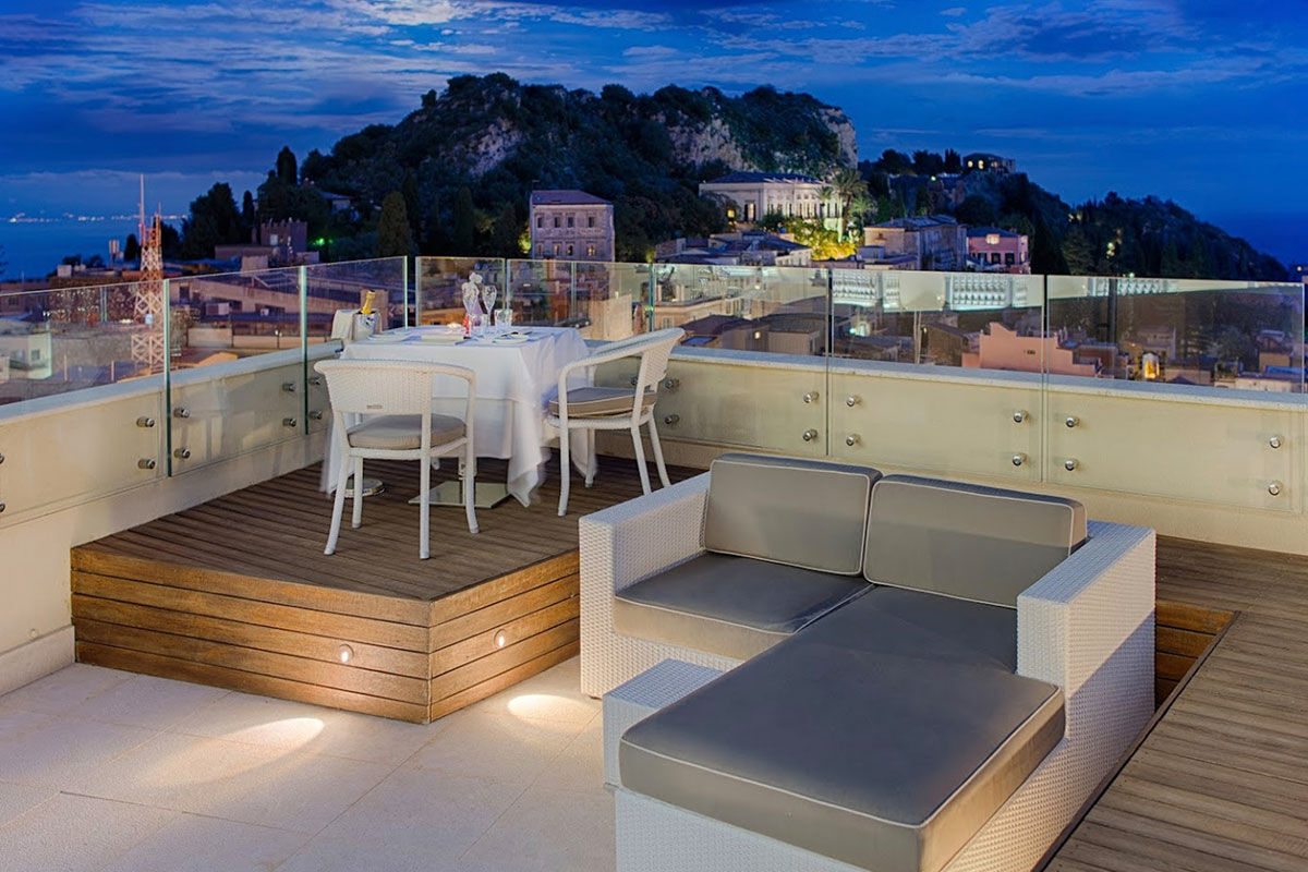 <b>NH Collection Taormina</b> - Modern and cool, the NH Collection Taormina features a roof-top terrace, cocktail bar and panoramic view of the Sicilian coast. The early 20th century architecture is stylish and adds to the polished Mediterranean feel.