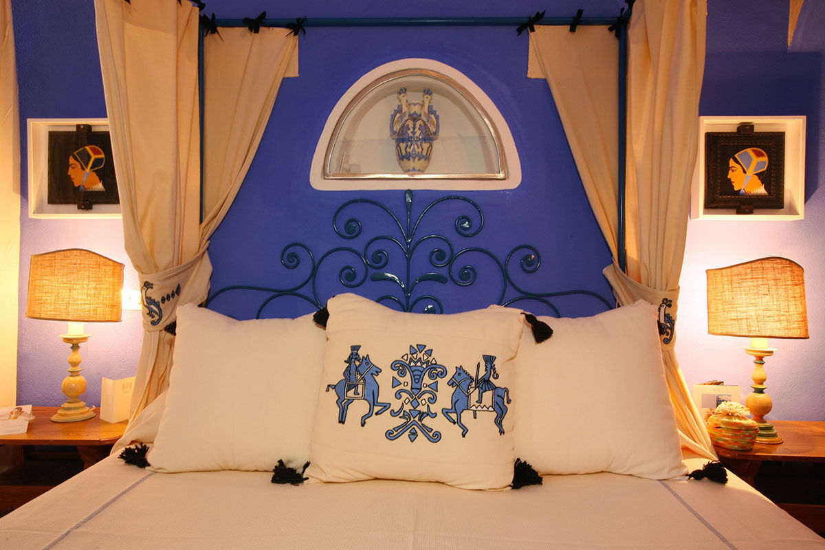 <b>Experience Hotel Su Gologone</b> - Hotel Su Gologone is the perfect escape for those who appreciate local art, food, wine and culture. Surrounded by the Supramonte mountaintops, this hotel has stunning sunset views; it hosts expert artists teaching classes on site, and showcases the bright colors and textiles of regional Sardinian crafts.