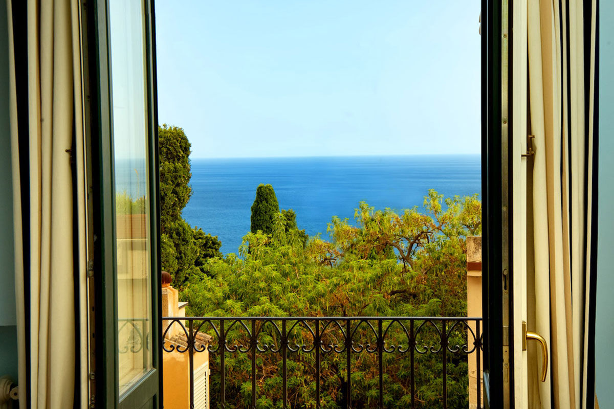 <b>Villa Carlotta, Taormina</b> - An independent boutique hotel on the banks of the Ionian Sea, Villa Carlotta is housed within an 1860 aristocratic villa with views of Mt. Etna. The local Sicilian cuisine served on the refined rooftop terrace makes this retreat absolutely idyllic.