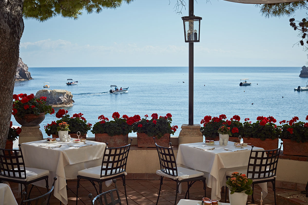 <b>Belmond Villa Sant’Andrea, Taormina</b> - Bright and airy, this 1830s hotel on Mazzaro Bay features cabanas lining their private beach and a pool overlooking the ocean. It is easy refinement meets glossy beach chic with a hint of Old-World glamor.