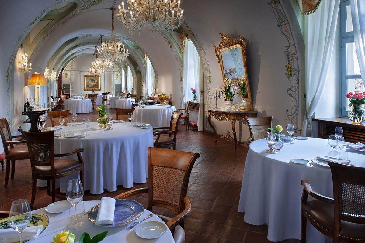 <b>Relais & Chateaux Castello di Guarene</b> - Set on a hill overlooking the lush landscape, this 18th century palace is striking in appearance. With a stately garden and an underground cave pool to enjoy, guests feel the grandeur and splendor of Old-World luxury.