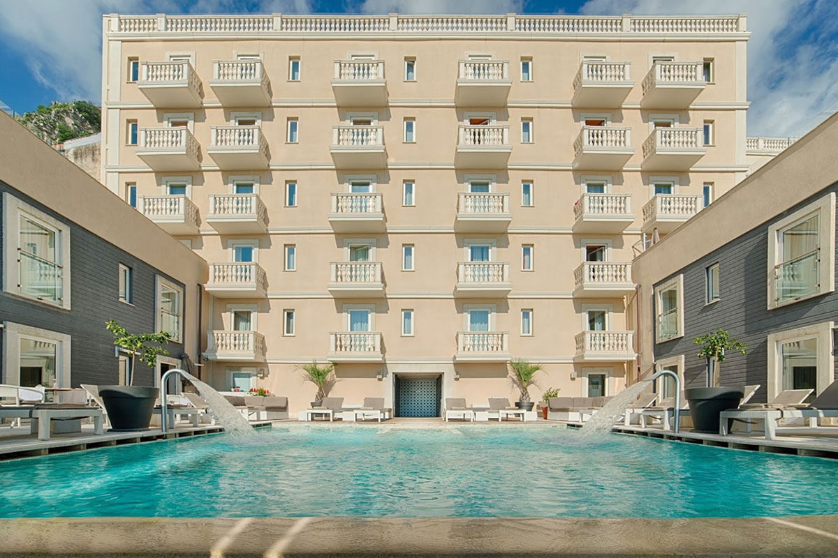 <b>NH Collection Taormina</b> - Modern and cool, the NH Collection Taormina features a roof-top terrace, cocktail bar and panoramic view of the Sicilian coast. The early 20th century architecture is stylish and adds to the polished Mediterranean feel.