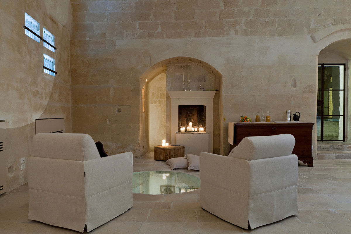 <b>Corte San Pietro, Matera</b> - Cave dwellings, tufa stone courtyards and herb gardens are all things you’ll find when arriving at the Corte San Pietro. Quite like a dream, you will sleep in a plush cave room with a design worthy of an architectural magazine.