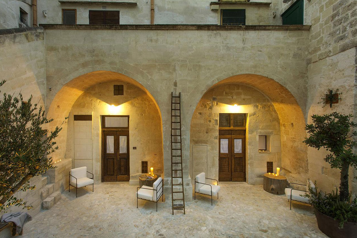 <b>Corte San Pietro, Matera</b> - Cave dwellings, tufa stone courtyards and herb gardens are all things you’ll find when arriving at the Corte San Pietro. Quite like a dream, you will sleep in a plush cave room with a design worthy of an architectural magazine.