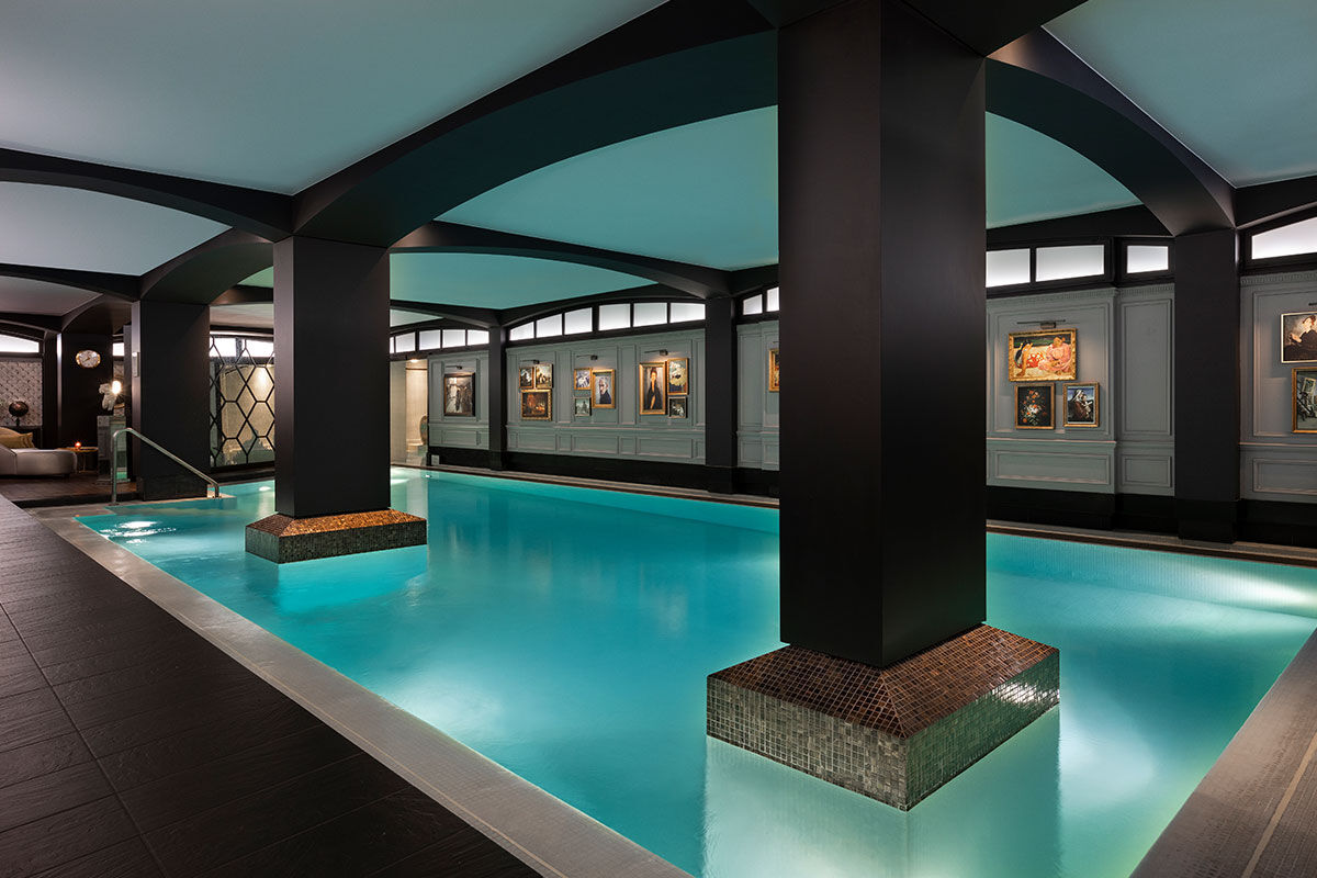 <b>Hotel Barriere Le Fouquet’s</b> - Only a 2-minute walk from the Avenue des Champs-Elysees, this upscale and moody hotel is set in a grand Napoleon III building, beckoning all who walk by. The curtains are velvet and silk, the pool features dark, stately pillars, and the luxurious rooms show off their mahogany woodwork and precious leathers.