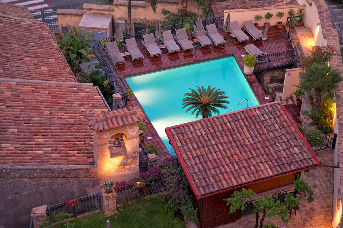 <b>Villa Carlotta, Taormina</b> - An independent boutique hotel on the banks of the Ionian Sea, Villa Carlotta is housed within an 1860 aristocratic villa with views of Mt. Etna. The local Sicilian cuisine served on the refined rooftop terrace makes this retreat absolutely idyllic.