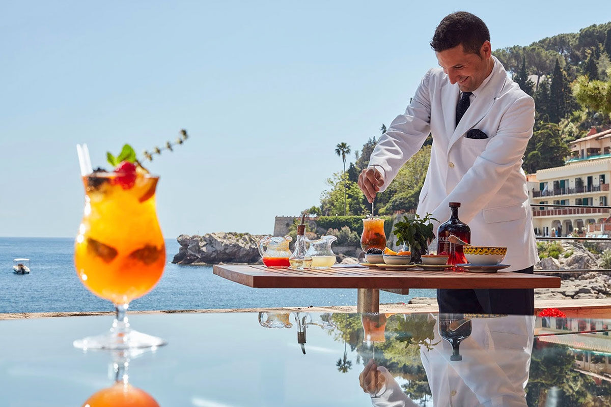 <b>Belmond Villa Sant’Andrea, Taormina</b> - Bright and airy, this 1830s hotel on Mazzaro Bay features cabanas lining their private beach and a pool overlooking the ocean. It is easy refinement meets glossy beach chic with a hint of Old-World glamor.