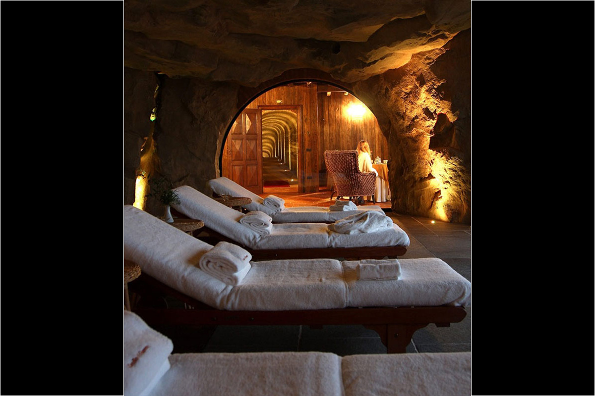 <b>Relais & Chateaux Castello di Guarene</b> - Set on a hill overlooking the lush landscape, this 18th century palace is striking in appearance. With a stately garden and an underground cave pool to enjoy, guests feel the grandeur and splendor of Old-World luxury.