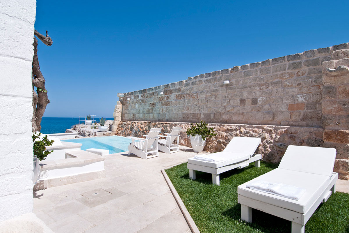 <b>Don Ferrante Dimore di Charme, Monopoli</b> - Once a fortress of the 16th century Castello Carlo V, this sprawling hotel has an airy feel within its whitewashed stone walls. Guests can create a tailormade itinerary to explore nearby cultural hot spots or take a more relaxing approach with a terrace sun lounger near the refreshing pool.