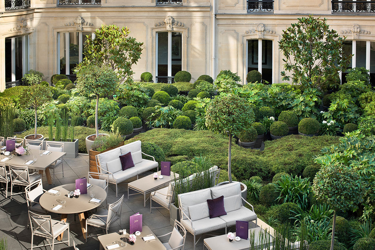 <b>Hotel Barriere Le Fouquet’s</b> - Only a 2-minute walk from the Avenue des Champs-Elysees, this upscale and moody hotel is set in a grand Napoleon III building, beckoning all who walk by. The curtains are velvet and silk, the pool features dark, stately pillars, and the luxurious rooms show off their mahogany woodwork and precious leathers.