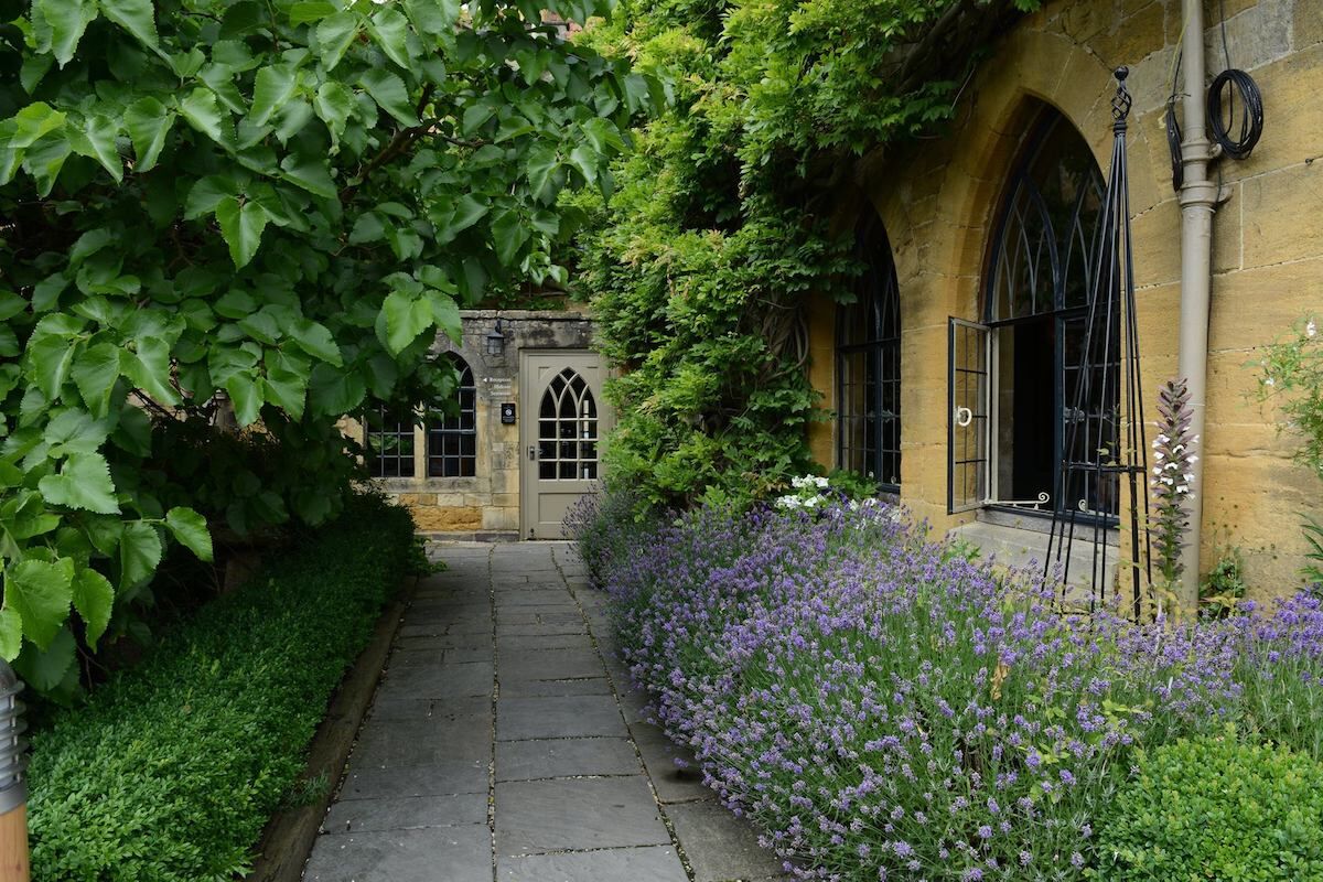 <b>The Manor House Hotel, Moreton-in-Marsh</b> - The Manor House Hotel and is a handsome 16th century retreat with stunning walled-in gardens featuring their famous mulberry tree. The stone architecture is enchanting, the rooms are styled in great taste, and several fireplaces make for a cozy environment. Finesse is here.