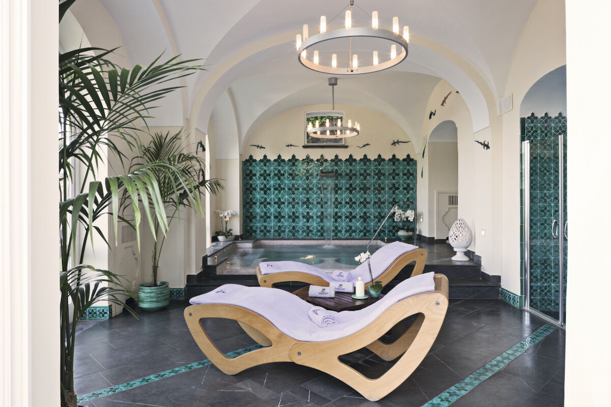 <b>Palazzo Avino, Ravello</b> - Named the ‘Pink Palace’ by locals, the Palazzo Avino has been charming cosmopolitan travelers with its blush walls and terraced coastal gardens since the 12th century. With its Michelin-starred restaurant and terrace with views over the Tyrrhenian Sea, this luxury hotel holds on to its romantic glamor of old while bringing the contemporary plush of new.