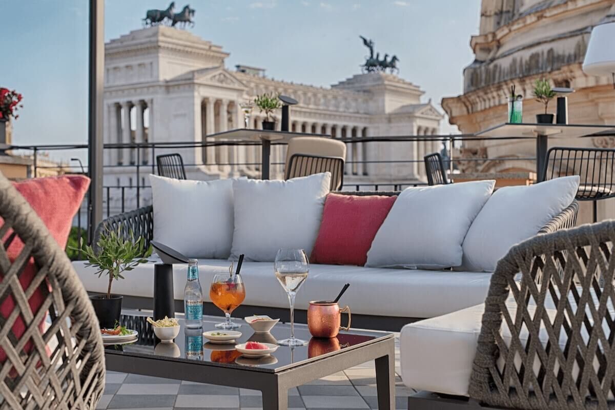 <b>NH Collection Roma Fori Imperiali</b> - Set overlooking the Roman Forum, this boutique hotel is home to a panoramic cocktail lounge, bistro, and two bars. With light and airy rooms, sweet dragonfly wallpaper and checkered marble floors, this charming hotel is a calming retreat after a day of exploring.